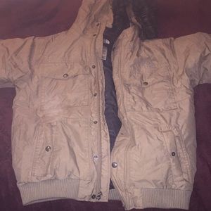 Tan “The North Face” snorkel puffer jacket